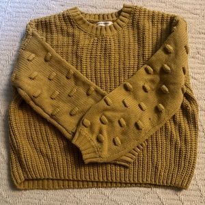 oversized cropped crewneck sweater with statement sleeves